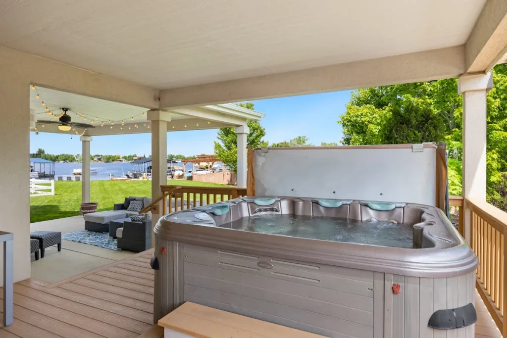 Multi-seat hot tub spa on a covered patio deck — how to choose a hot tub UK guide