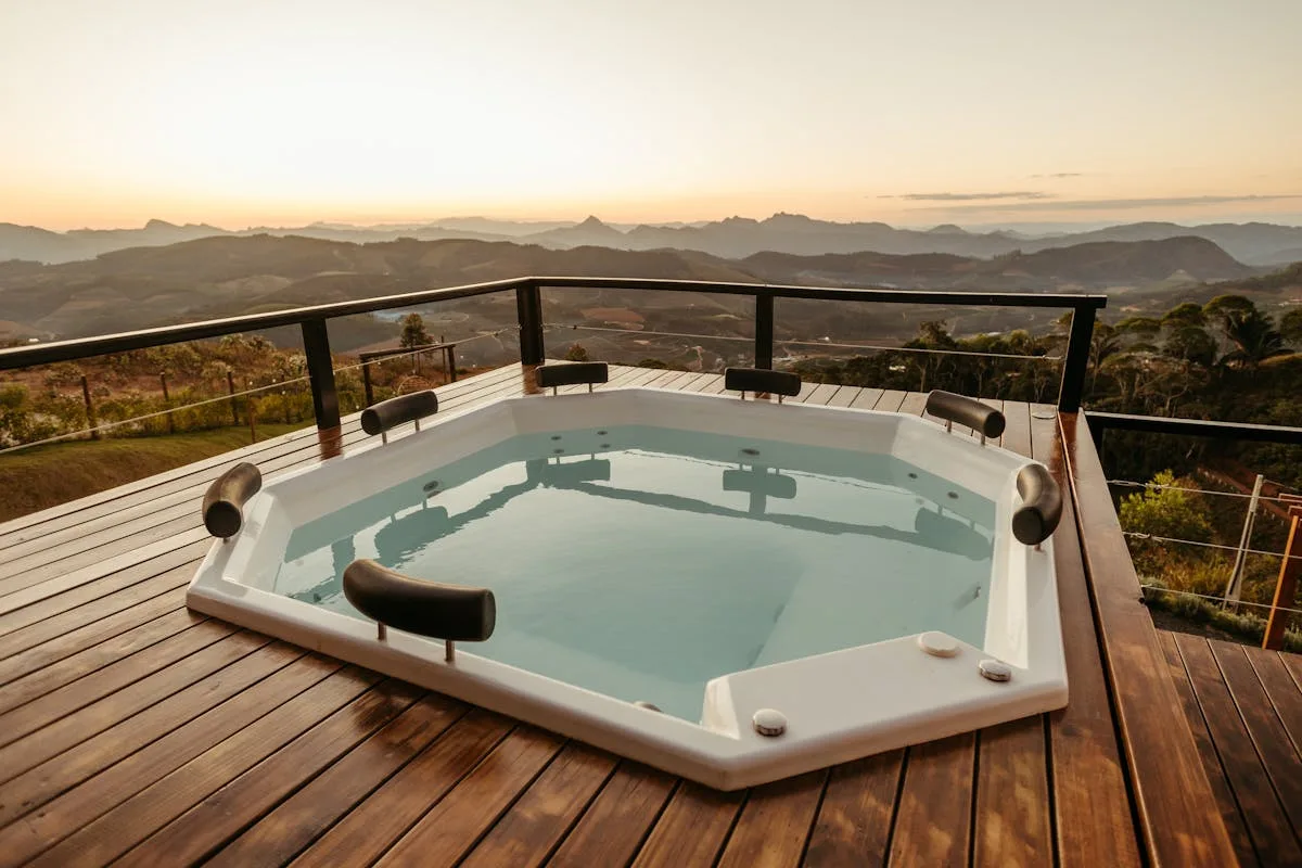Hot tub with LED lights on a frosty UK garden deck at night