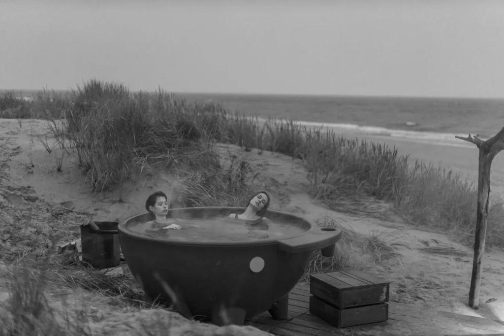 Outdoor garden hot tub with steam rising during evening — best hot tubs under £3,000 UK
