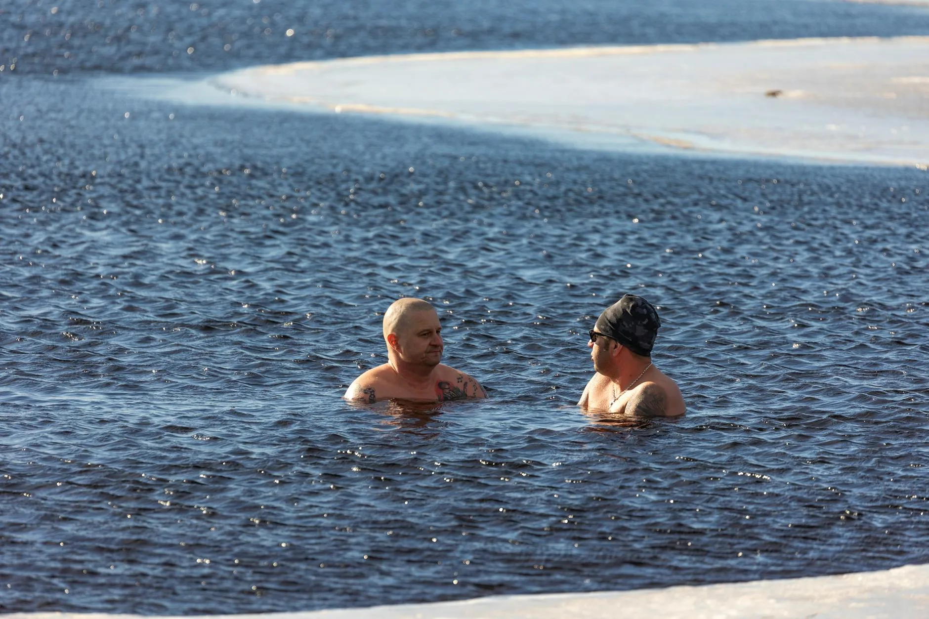 Person in cold plunge tub for recovery therapy