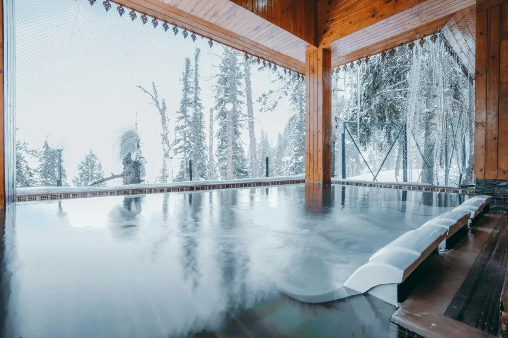 Jacuzzi hot tub with bubbling water on an outdoor wooden deck