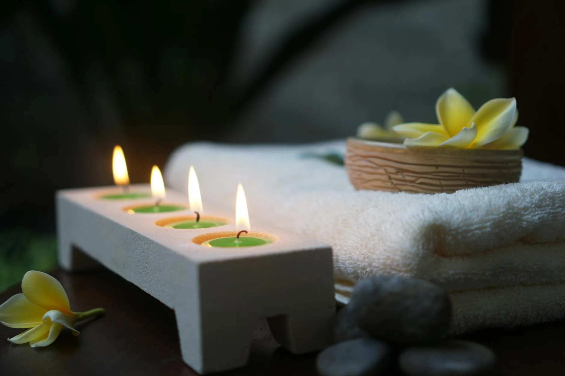 Spa candles and wellness relaxation products in warm light