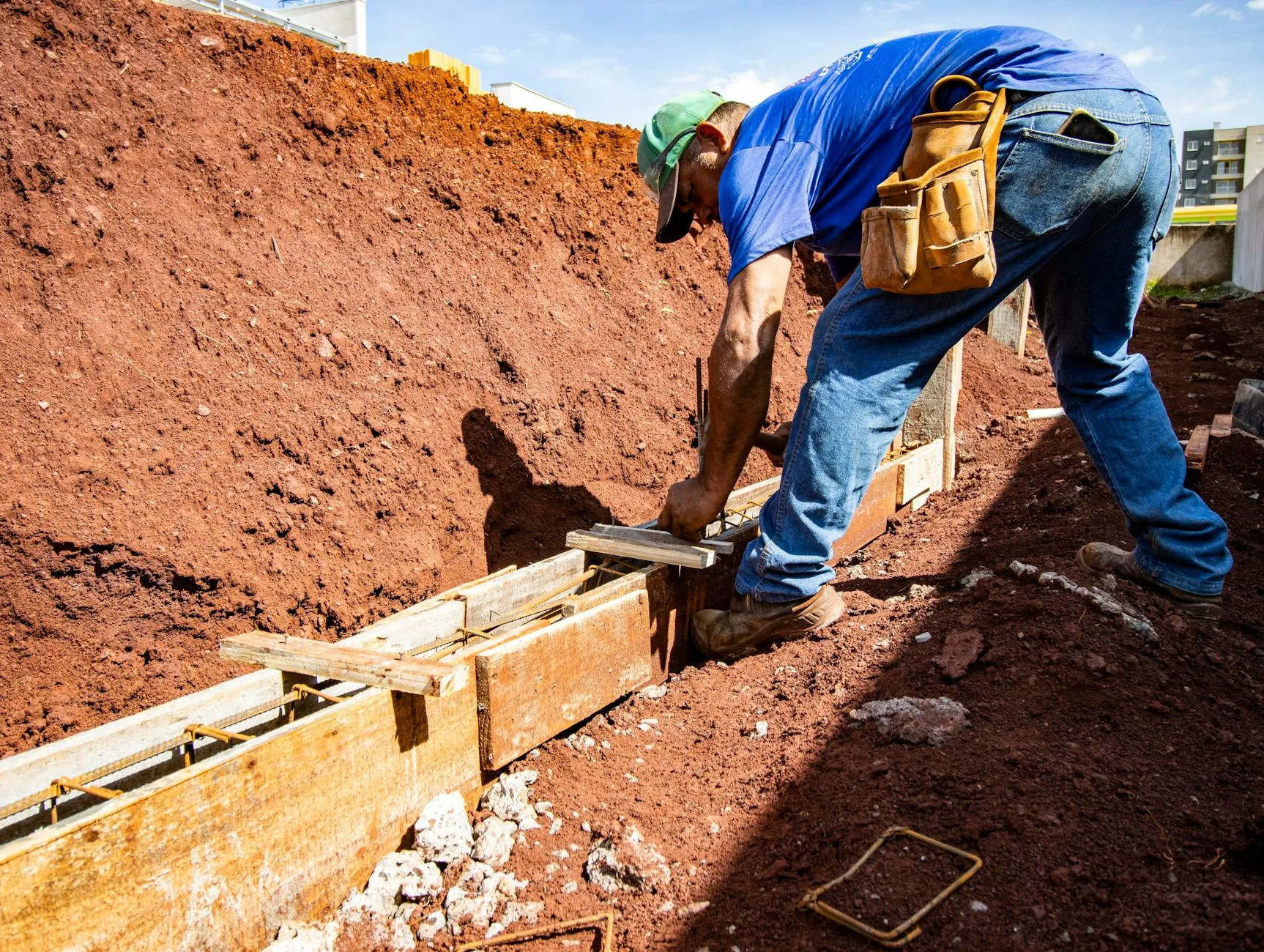 Reinforced concrete base prepared for outdoor installation