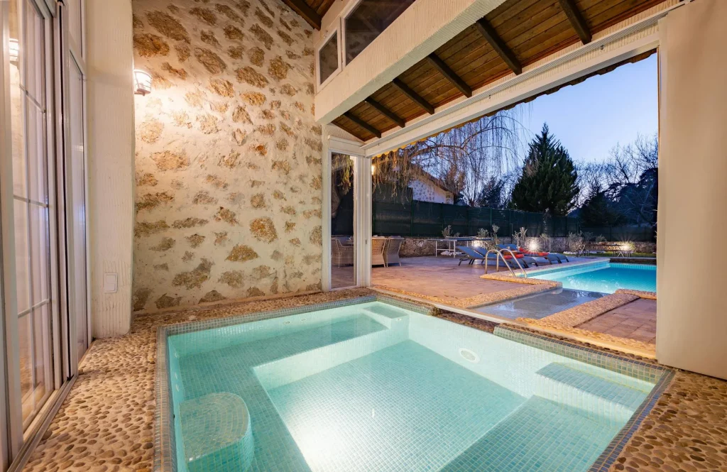 Swim spa installed in an outdoor garden patio setting