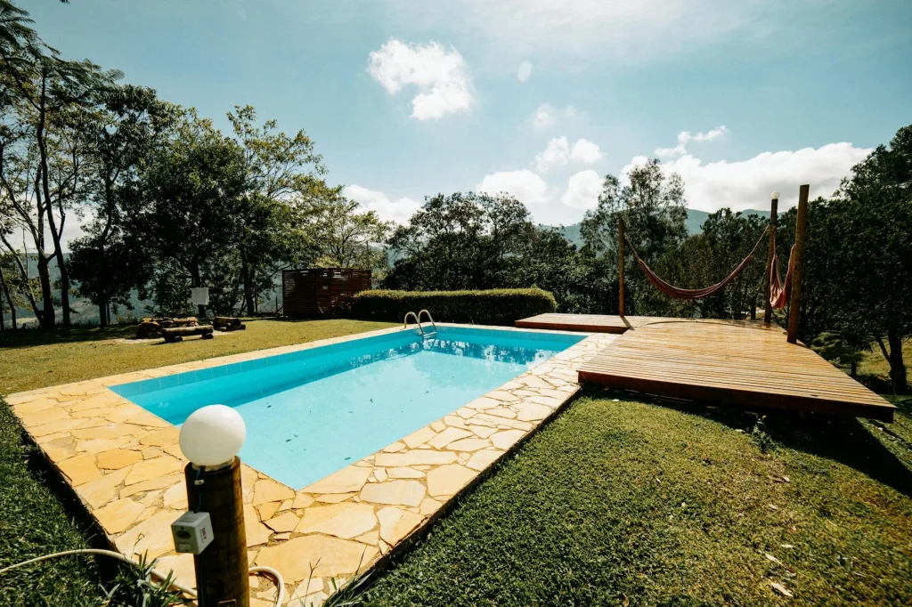 Swimming pool with blue water in a garden setting