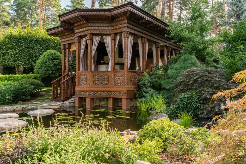 Wooden gazebo structure in a garden setting