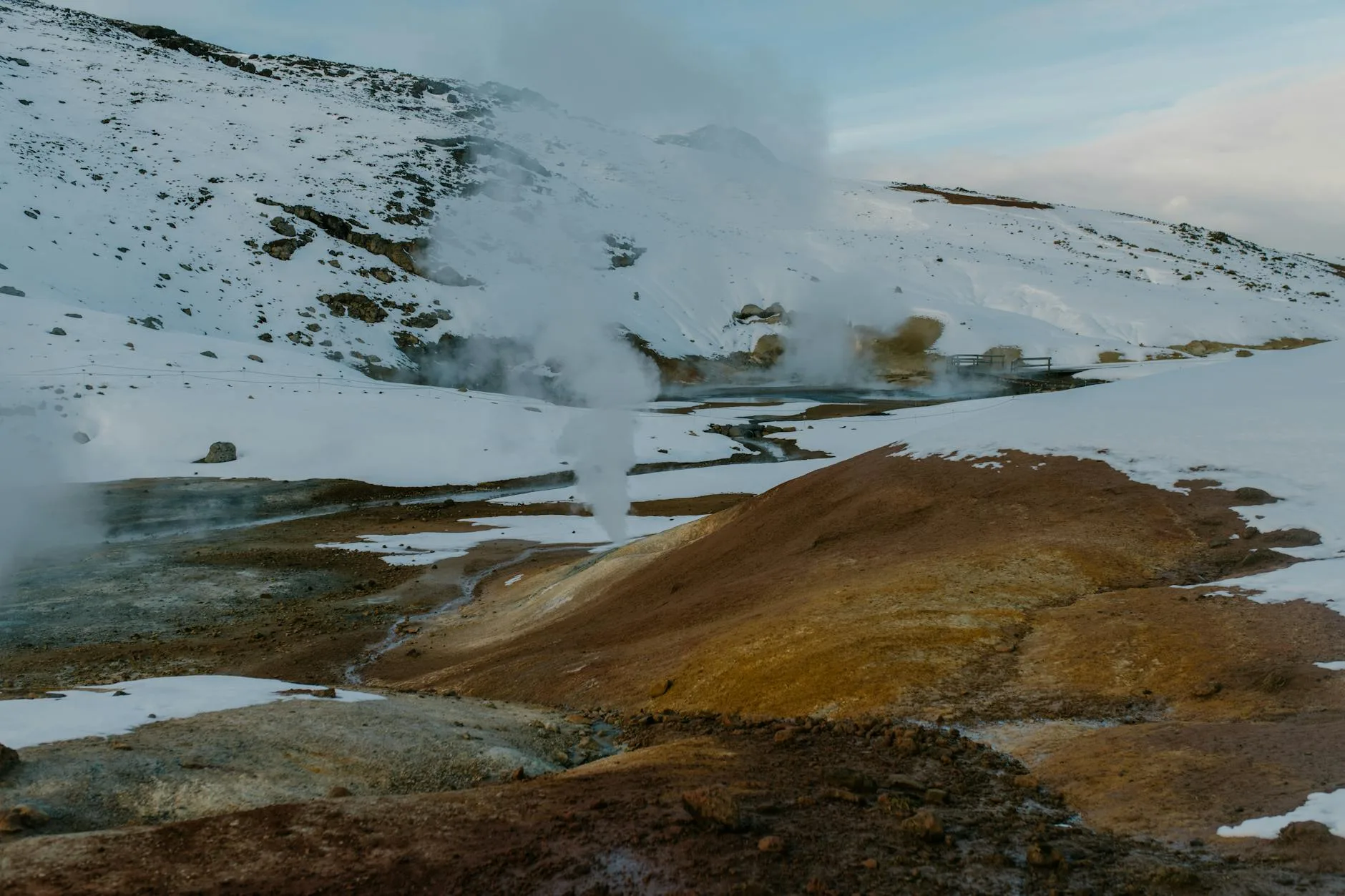 Hot tub steaming in winter with snow around