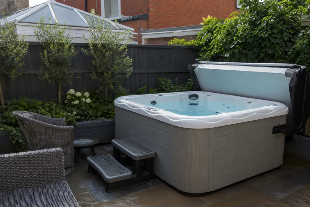 Second hand hot tub in a garden ready for inspection